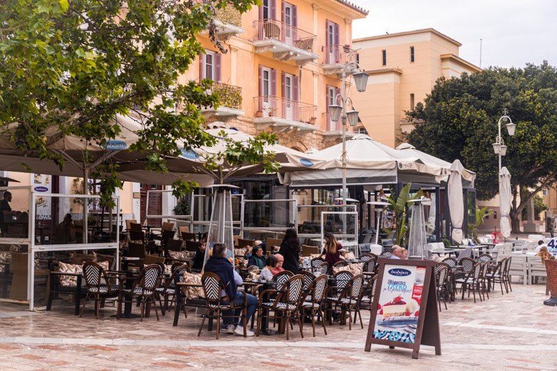 people sitting outside restaurant