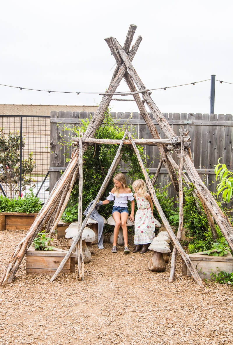 kalyra and savannah sitting inside naked tipi s