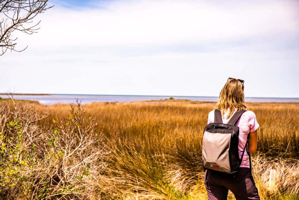 woman wearing backpack looking at view