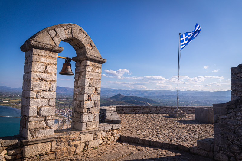 bell tower and flag flying at top of Palamidi castle