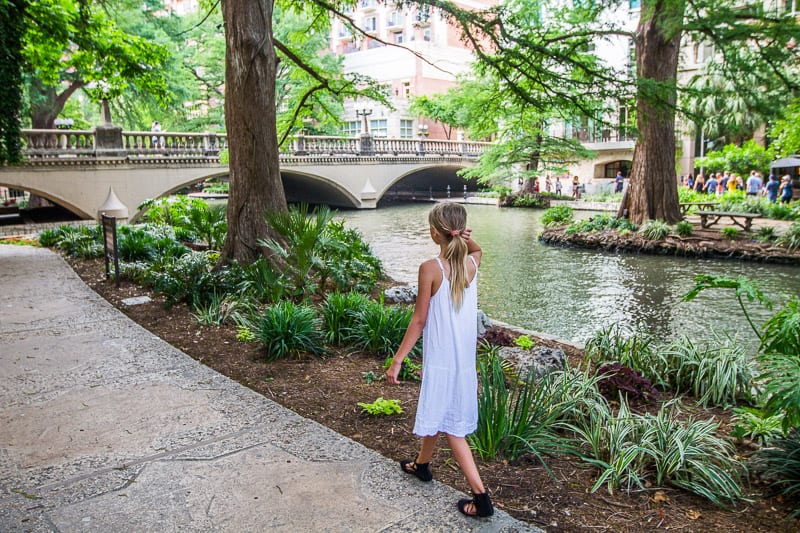 kalyra wlaking on the San Antonio River Walk