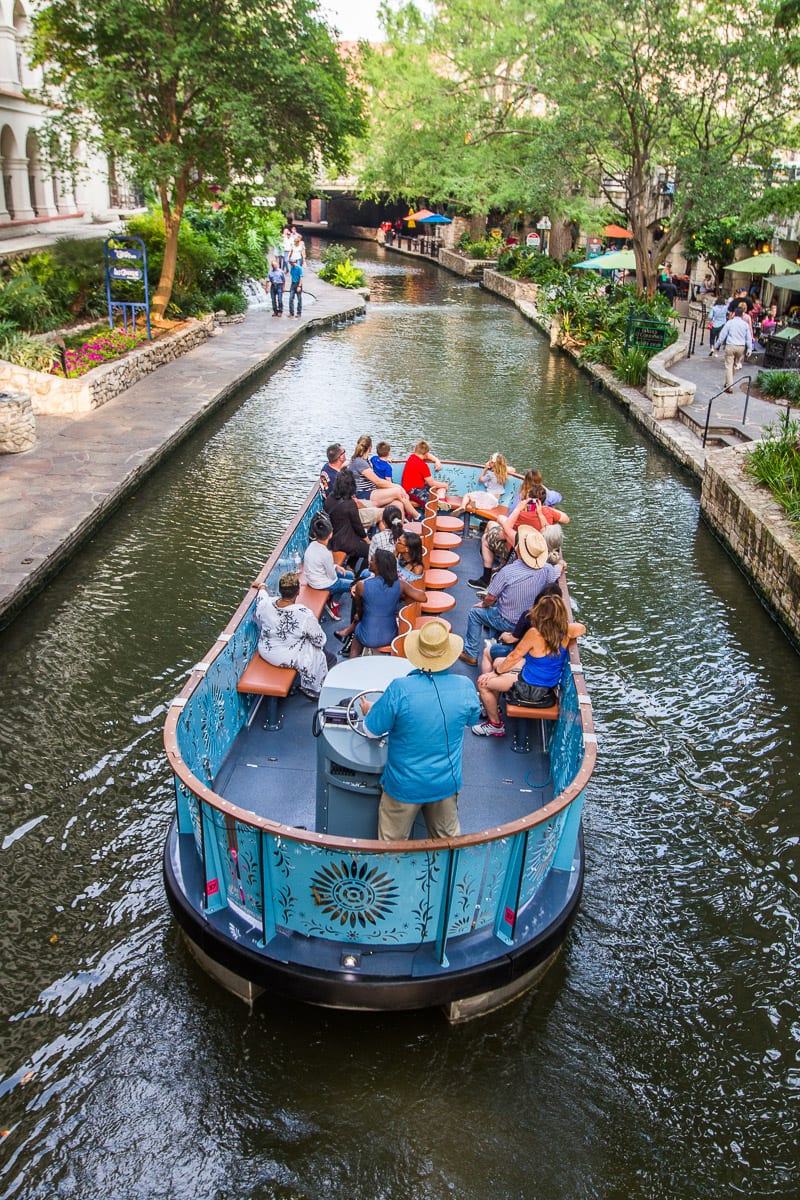 boat floating down san antnio river