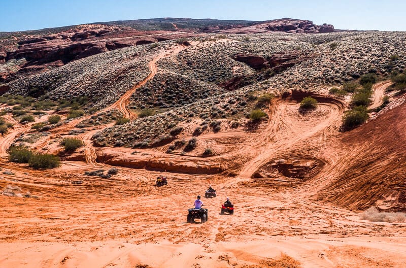 ATV's gong down the dunes