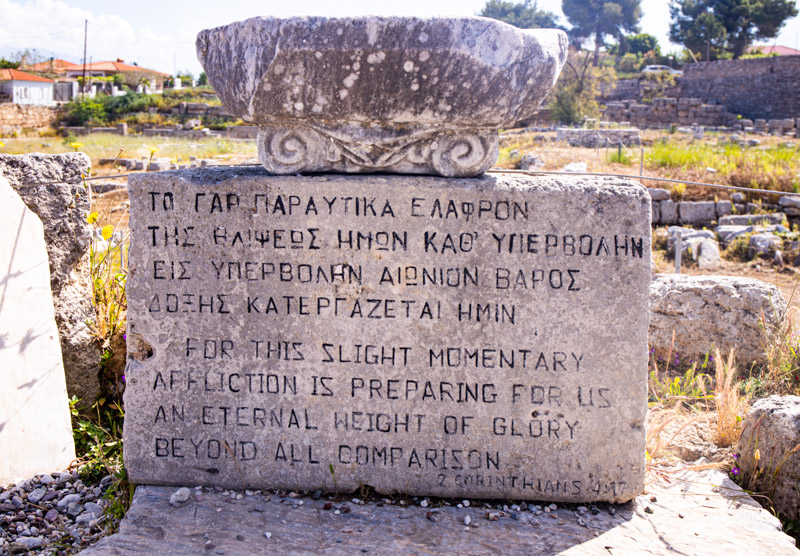 words from st paul engraved on a marble column