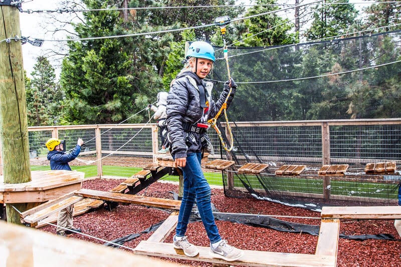 girl walking plank at kids adventure course tenaya lodge