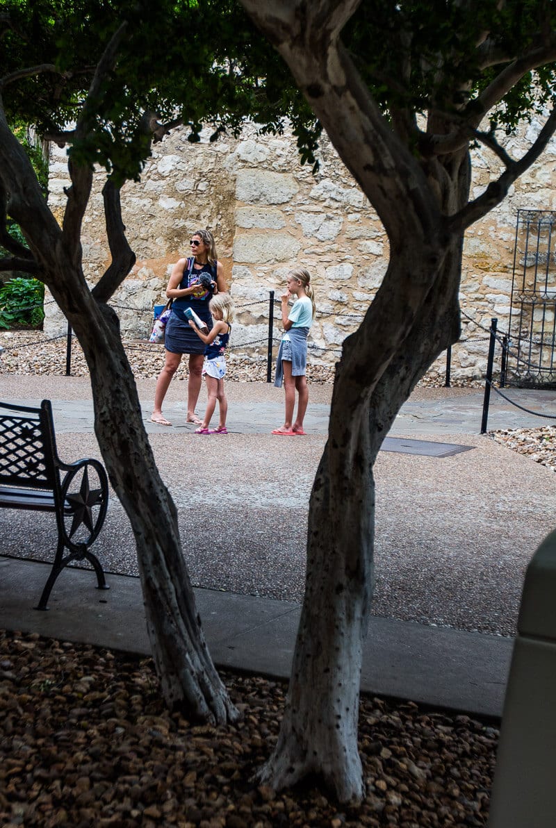 girls standing outside the alamo