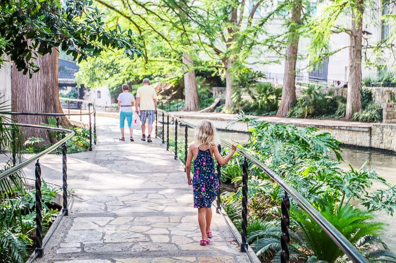 savannah walking on stone path beside river