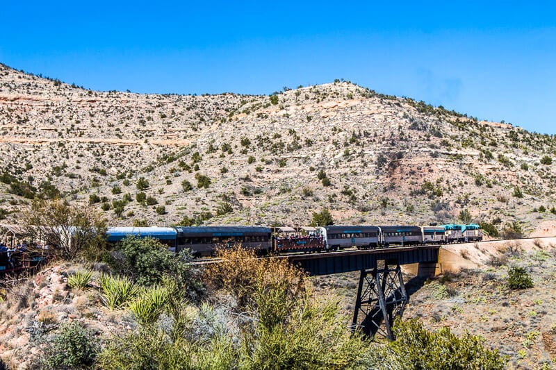 train going over bridge in verdde canyon