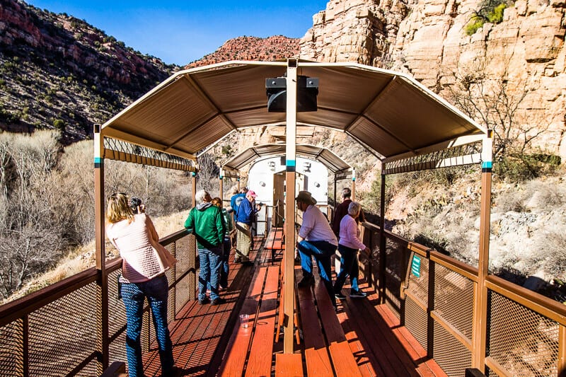 people standing on an outside train