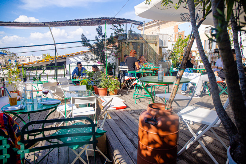 people sitting on roof top garden at Yiasemi