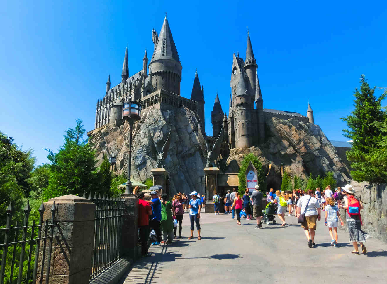 People walking in front of castle