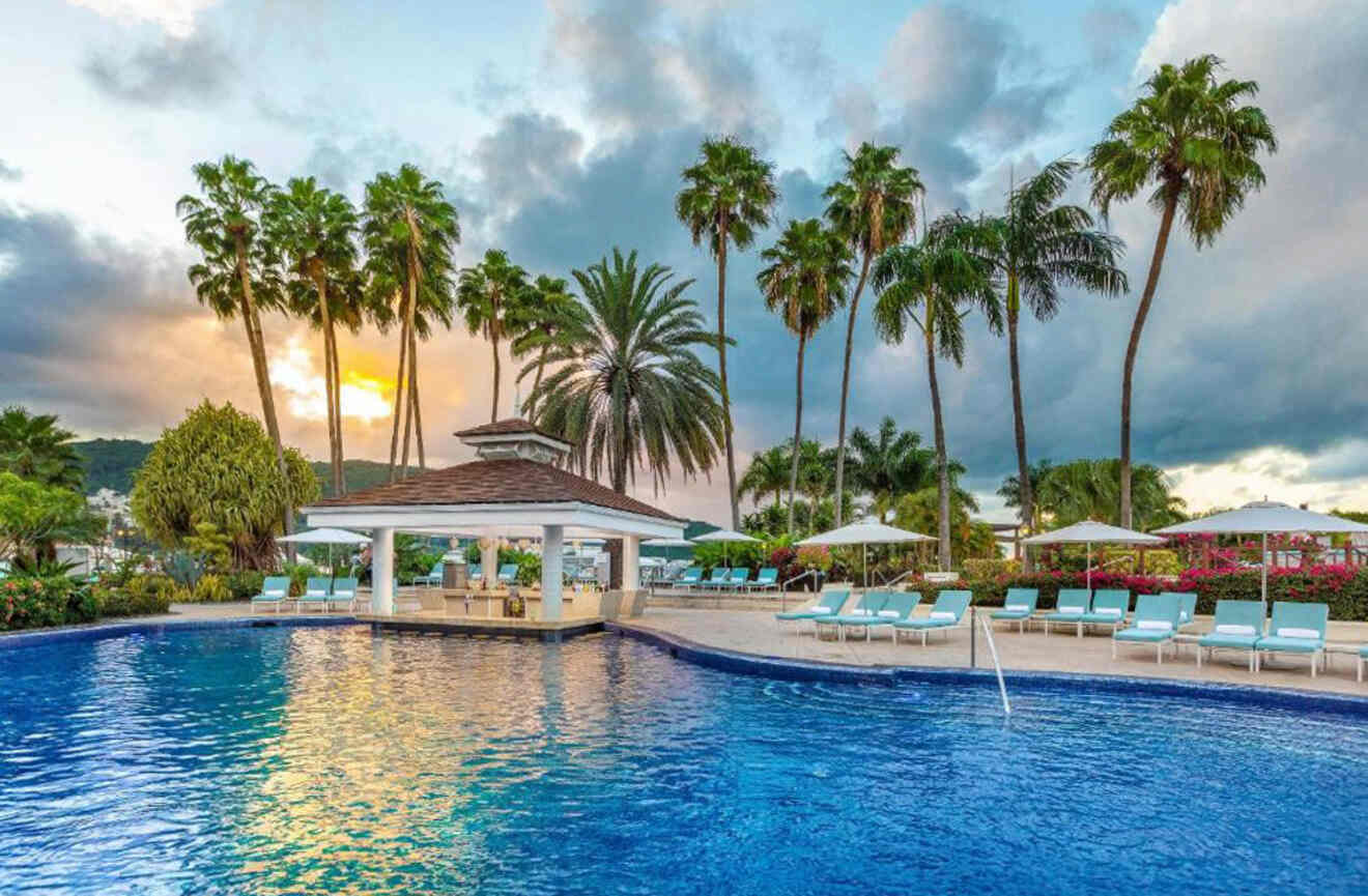 View of outdoor pool at sunset