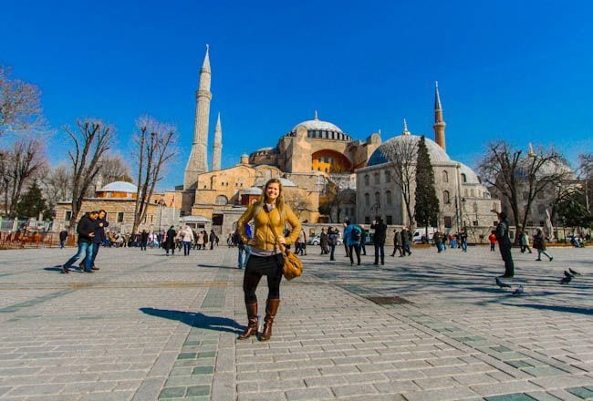 woman standing in front of mosque Istanbul, Turkey