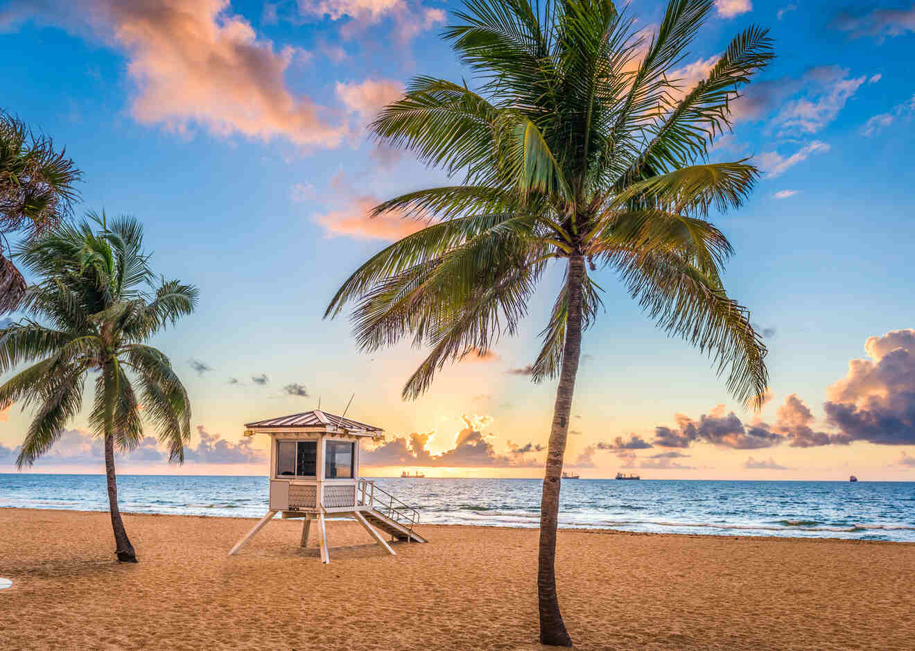 lifeguard house on the beach at sunset