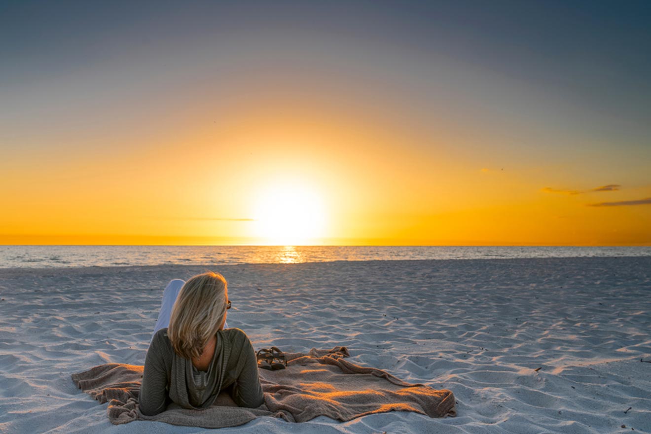 woman watching the sunset on the beach