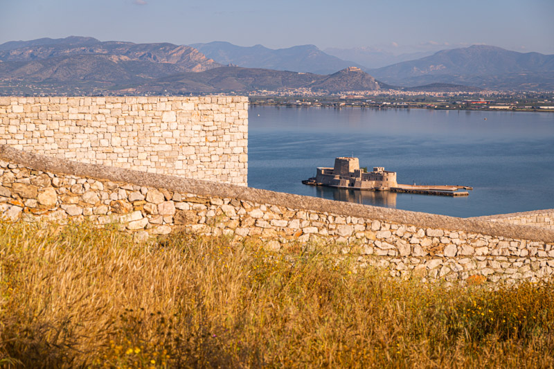 views of bourtzi castle and mountans in the background