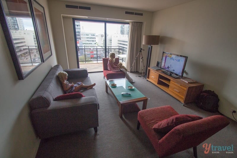 kalyra and savannah watching tv in partment