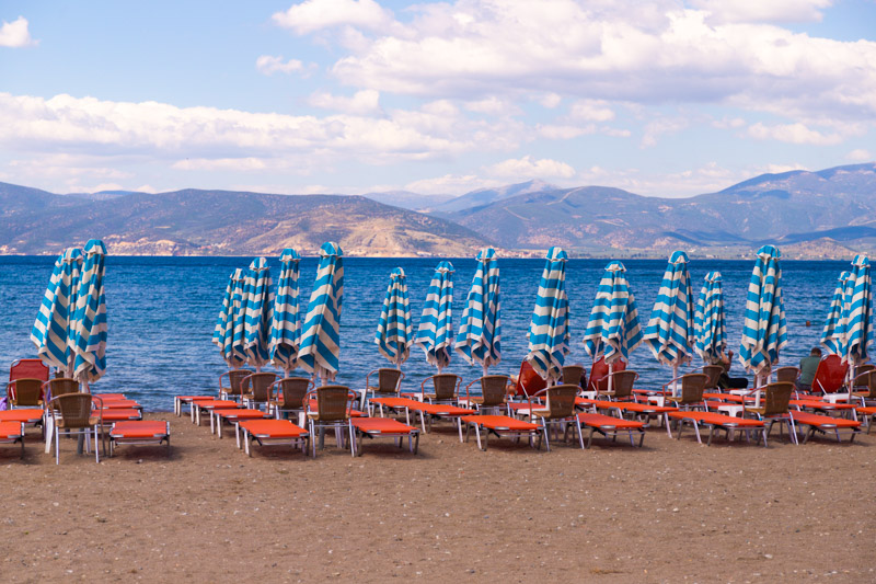 sunbeds and umbrellas on Karathoa beach facing the water