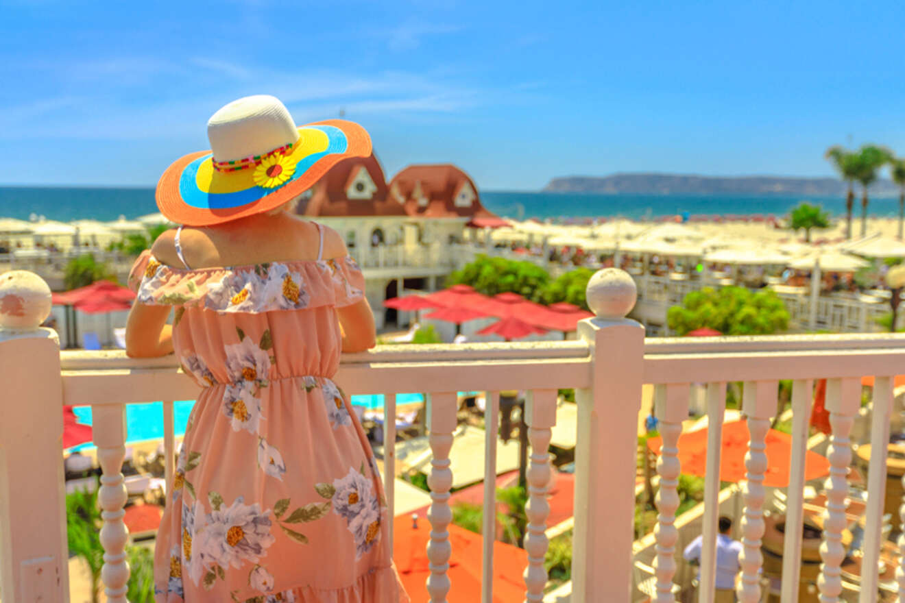 A women looking at the view from a hotel balcony