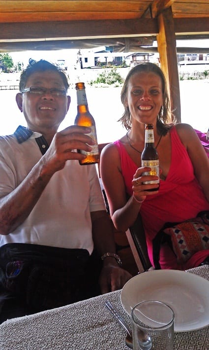 people holding up bottles of beer