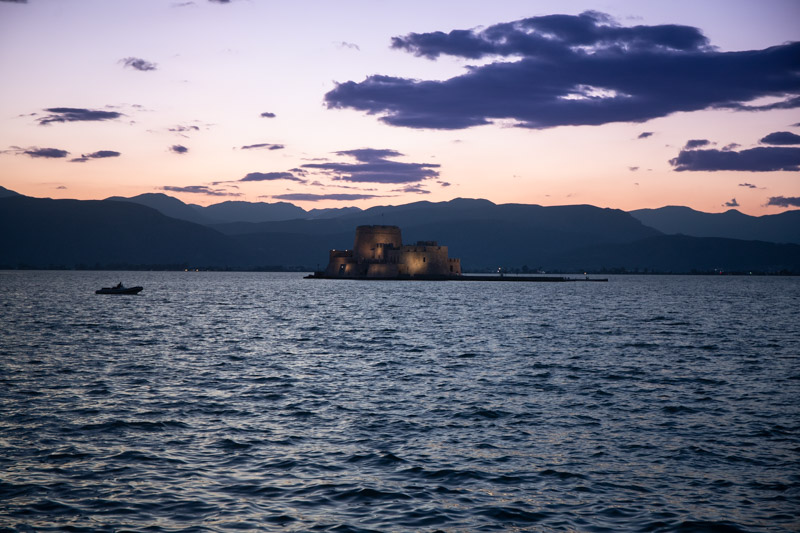 bourtzi castle in sillouhette at sunset