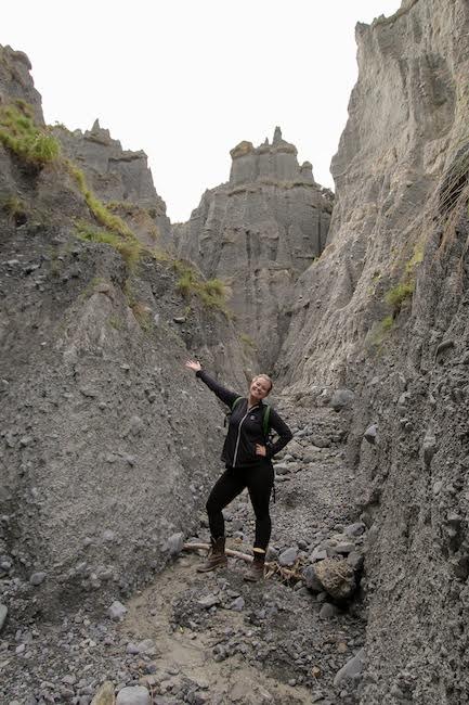 girl with arms open hiking in New Zealand 