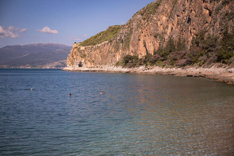 people swimming in old town beach early morning