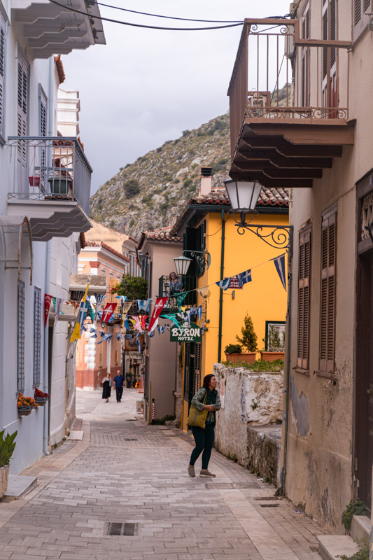 people walking through the cobbelstone streets of old town