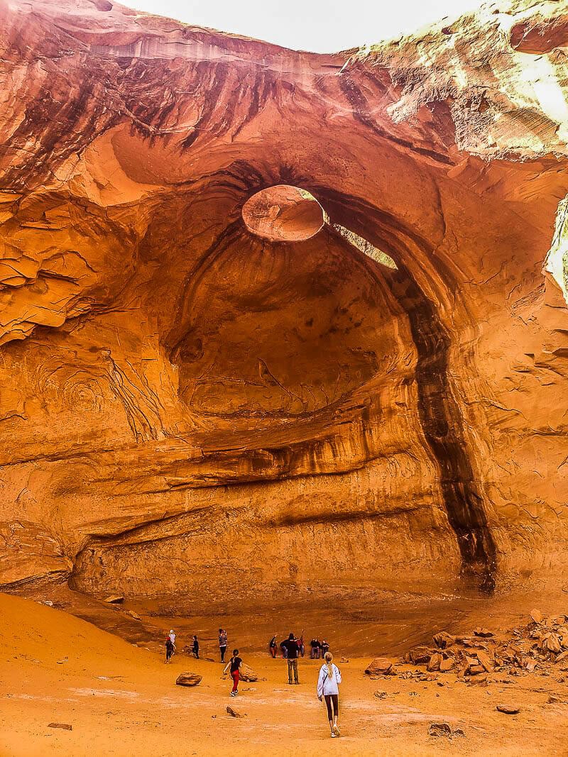 people looking at the The Big Hogan Arch 