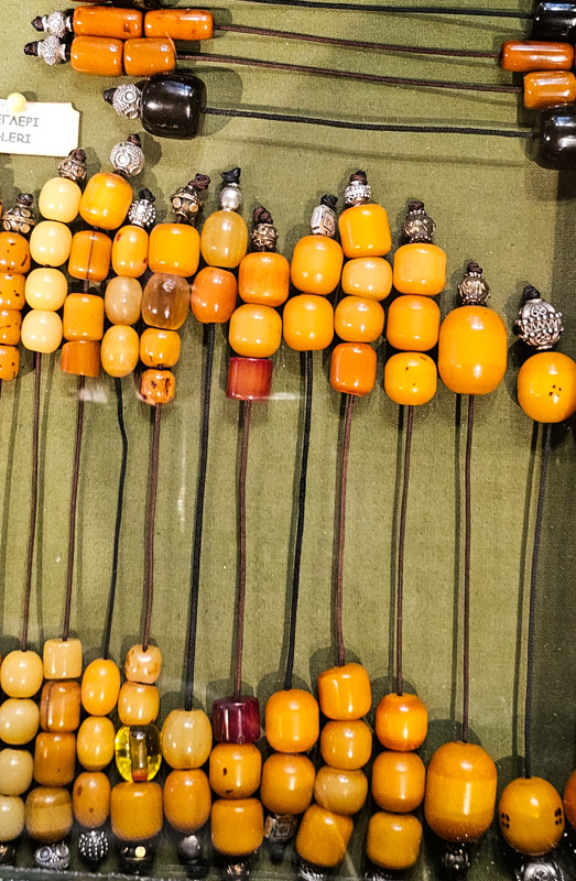 amber Komboloi beads in display case