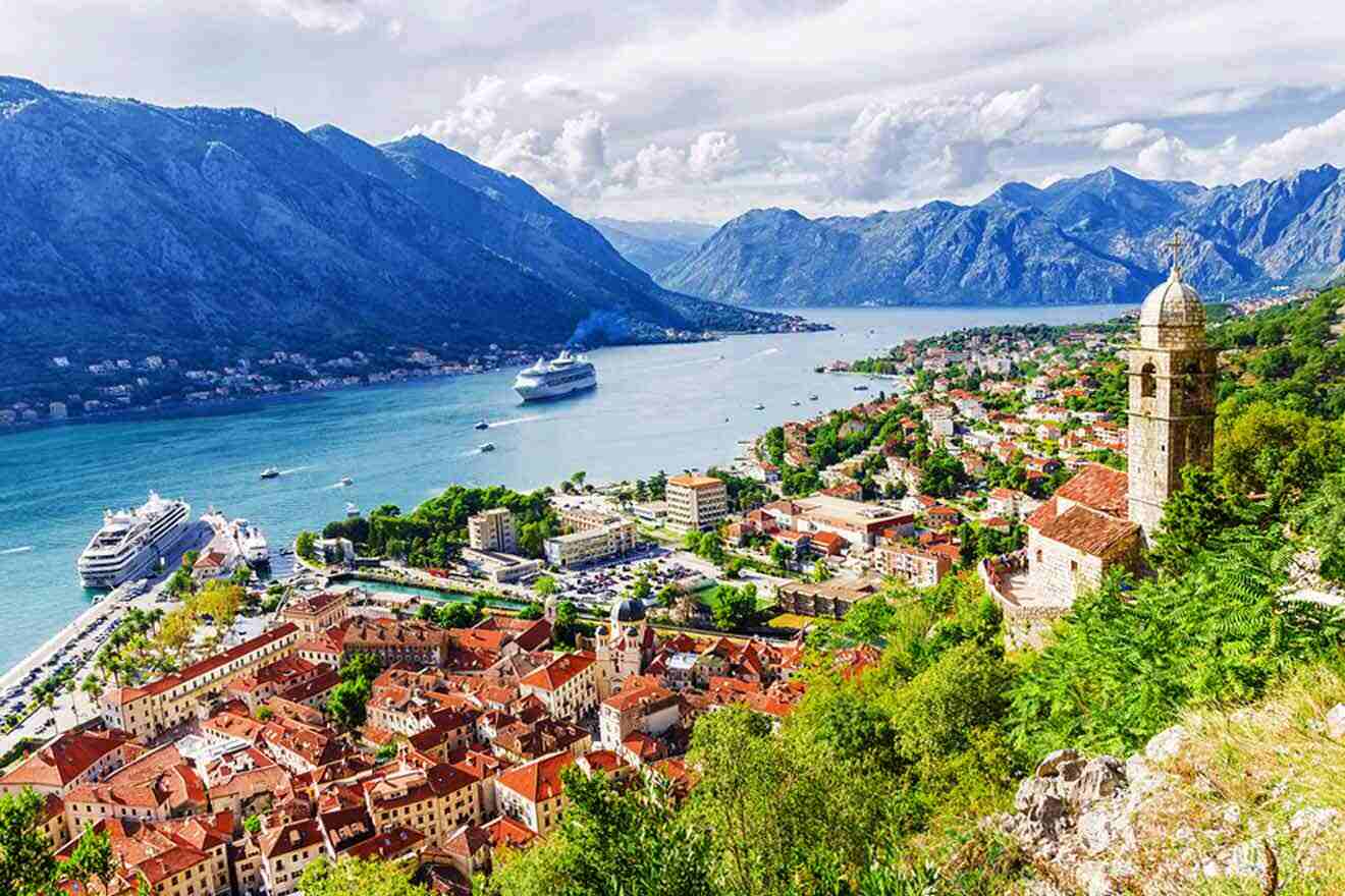 a scenic view of a town and a body of water