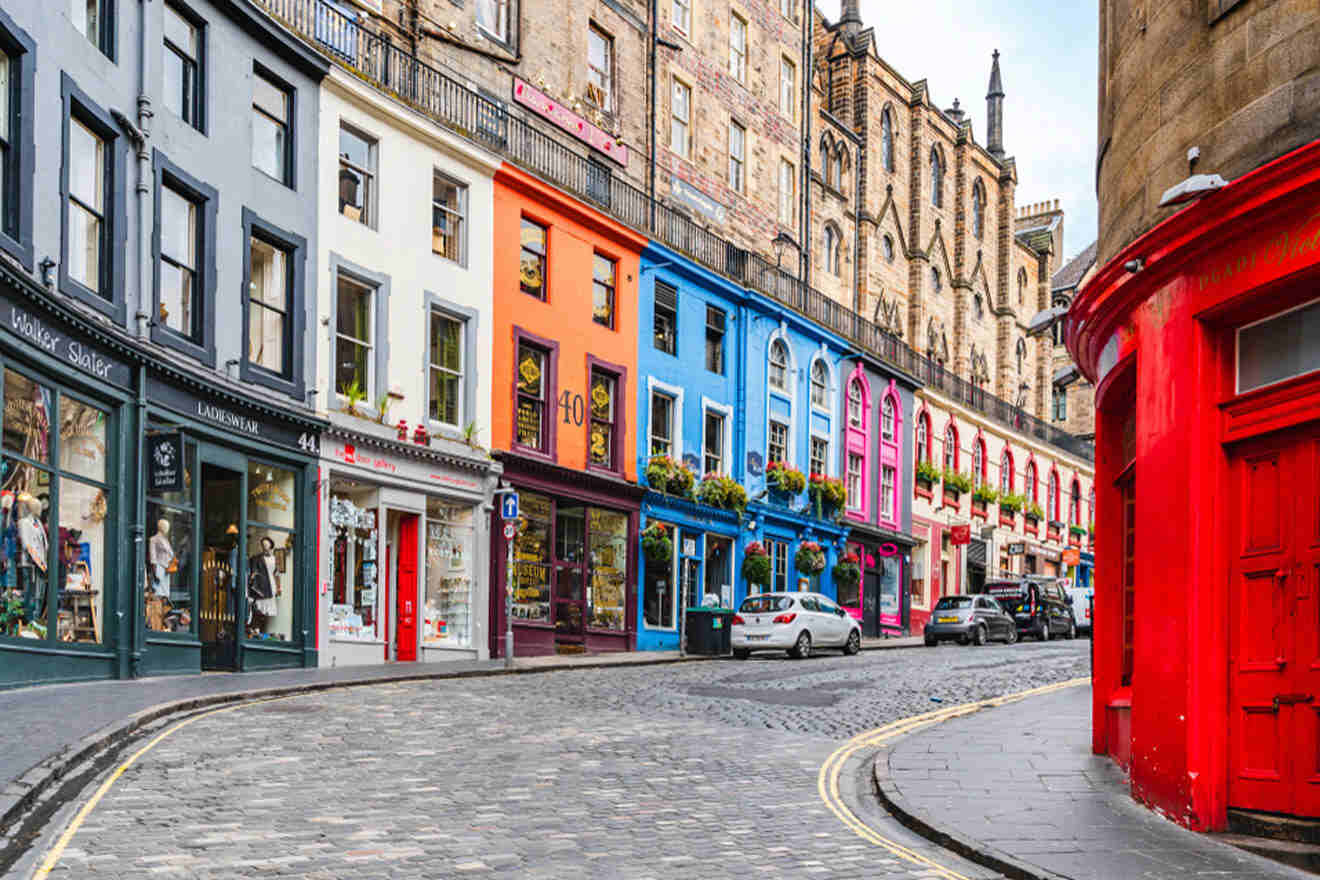 a cobblestone street lined with colorful buildings