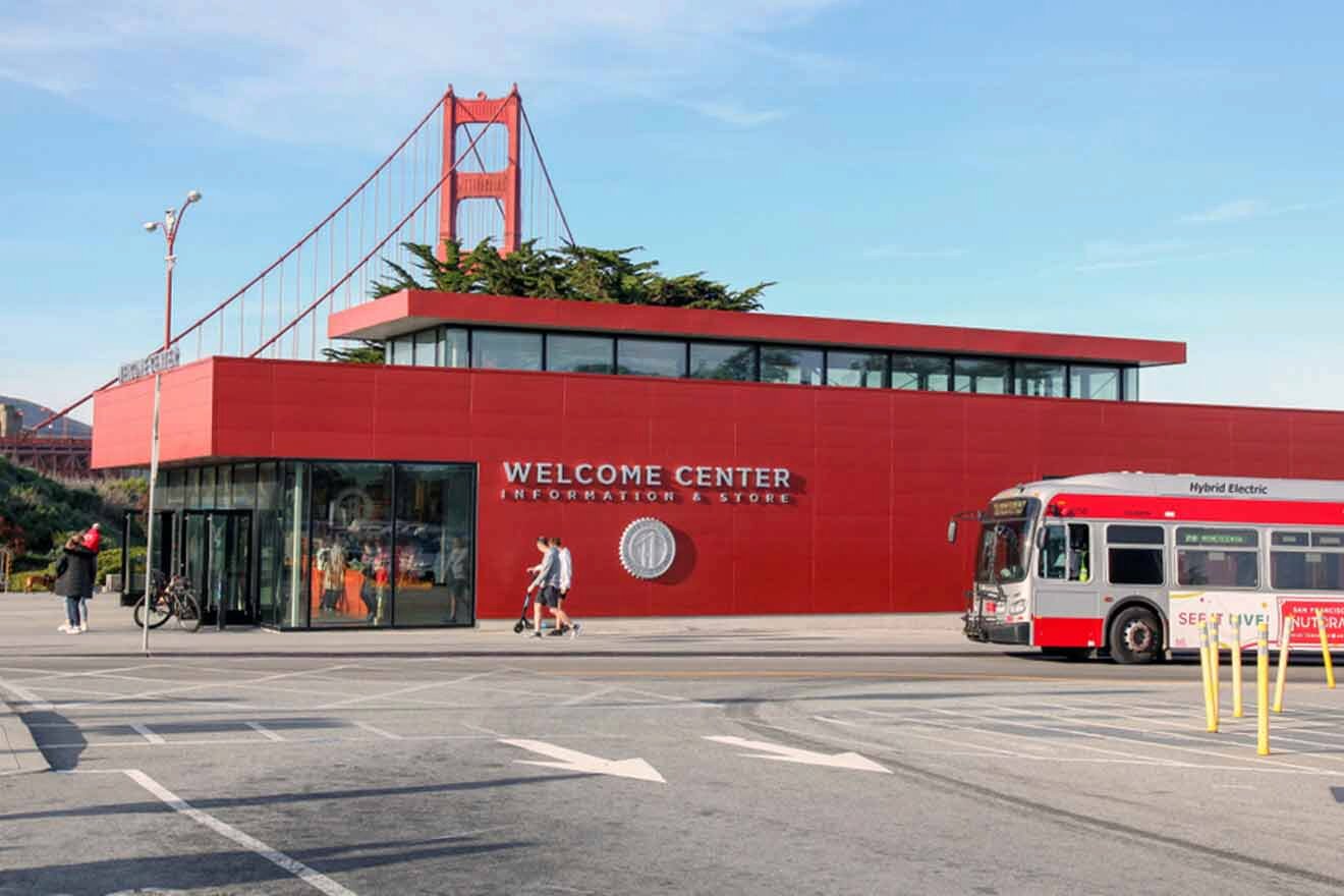 a bus parked in front of a red building