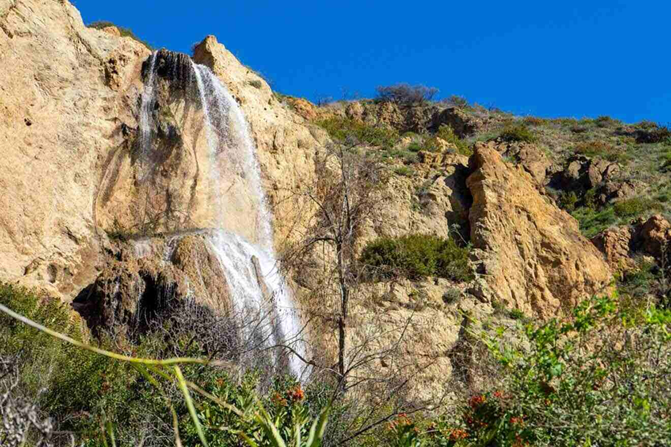 a waterfall in the middle of a rocky area