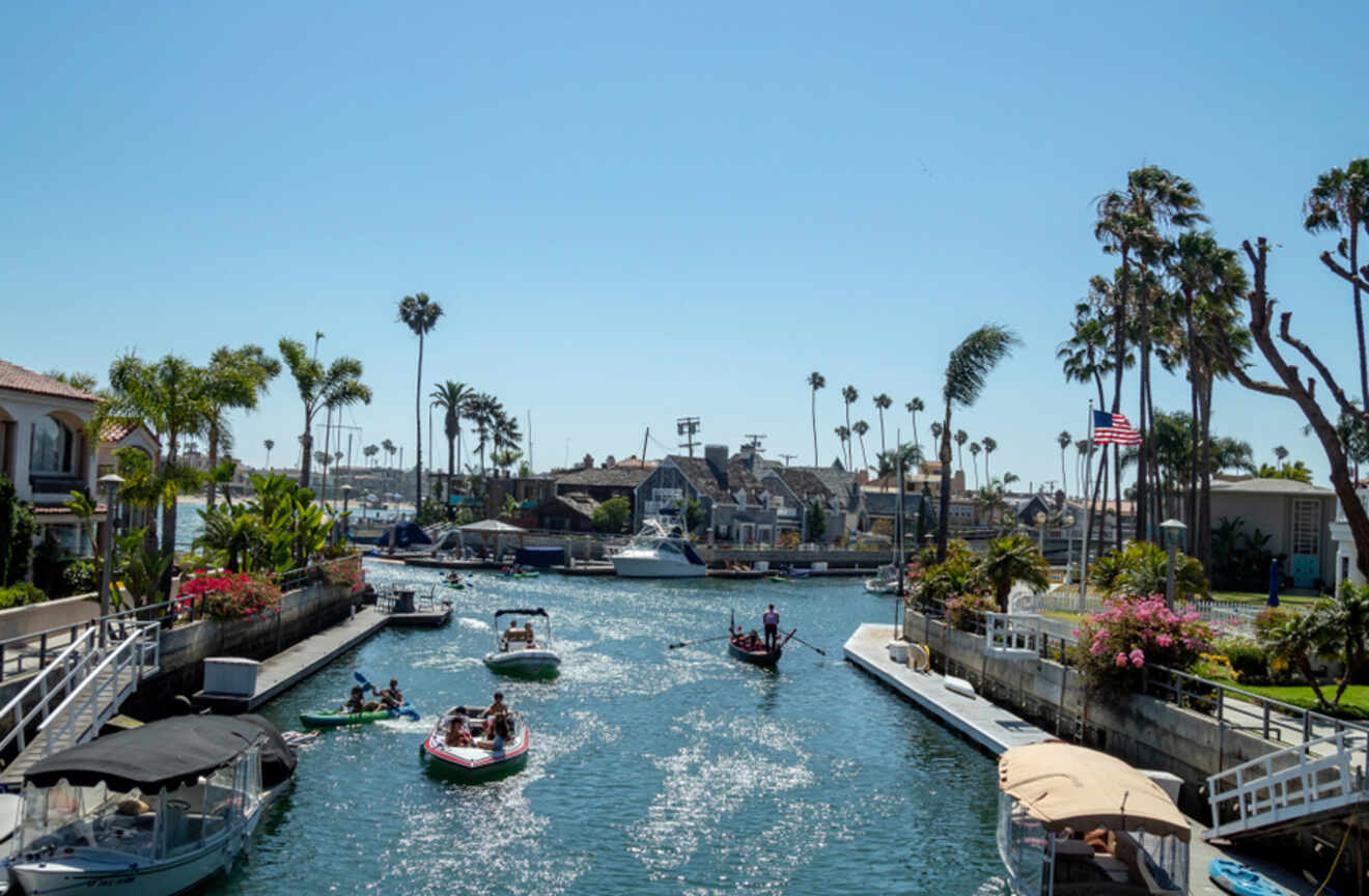 People on motor boats and gondolas in a canal