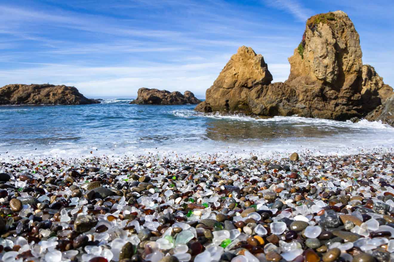 a beach covered in lots of different colored rocks