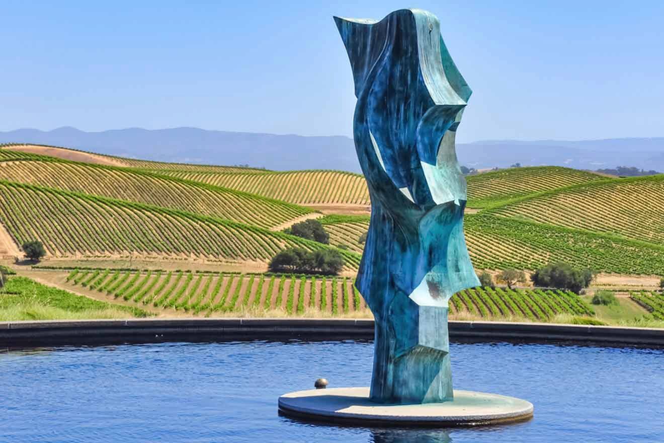 a statue standing in a pool of water