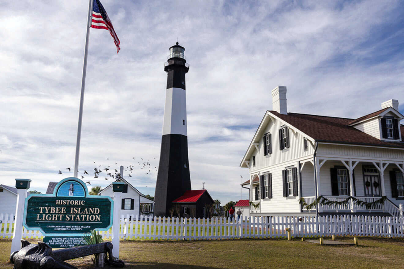 a white house and a black and white lighthouse