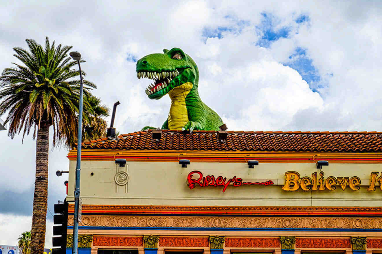 a large dinosaur statue on top of a building