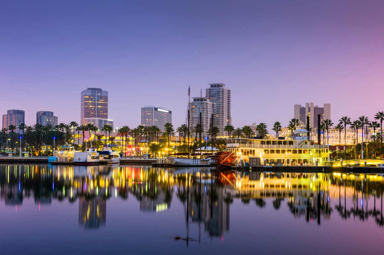 a city skyline is reflected in the water