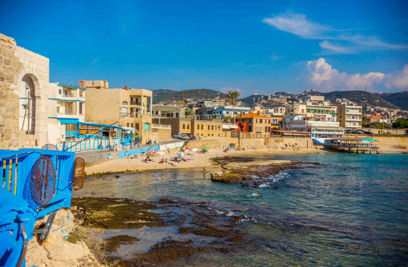 Beach restaurant by the sea with colorful wooden furniture and sea view in Batroun