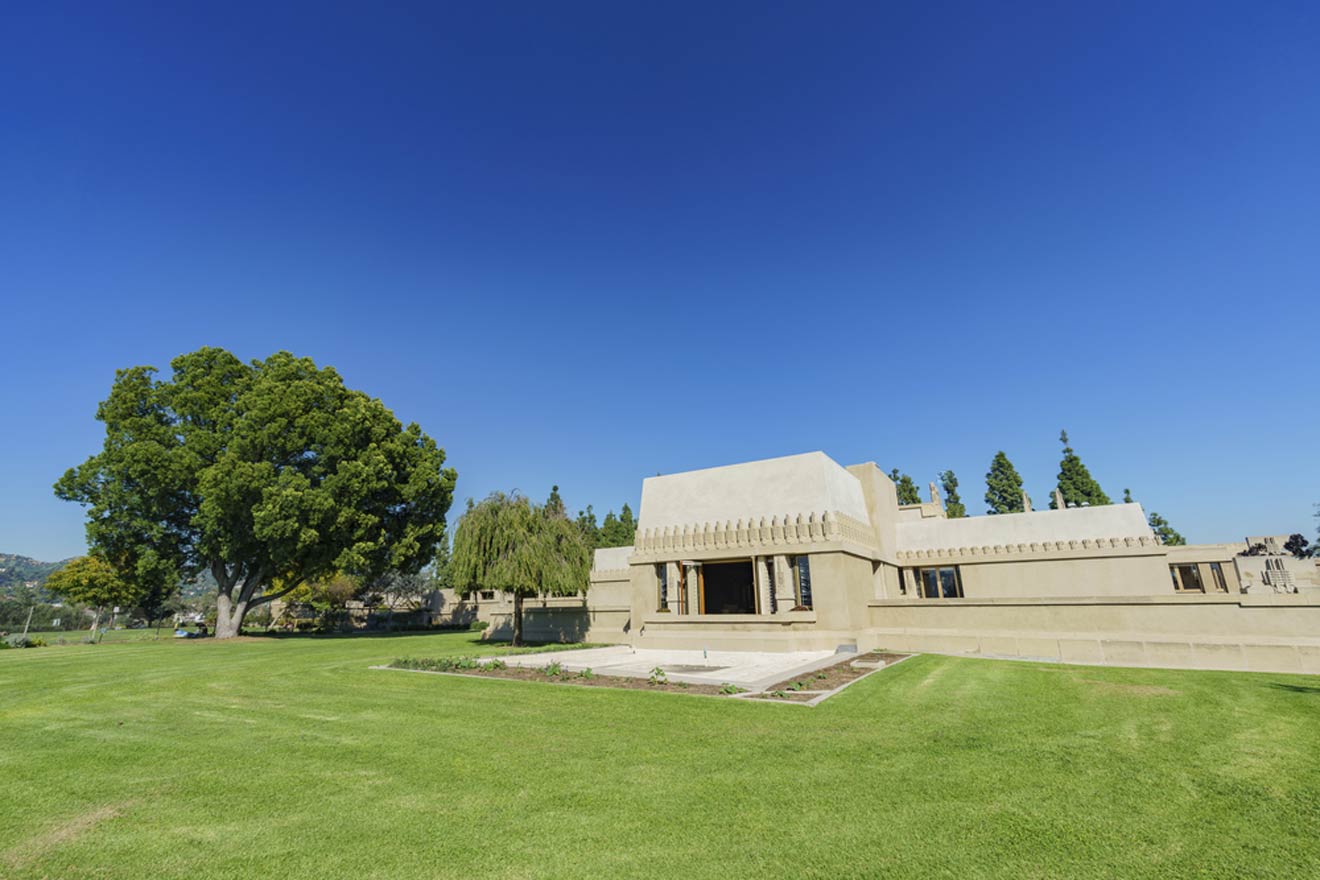 a house with a large lawn in front of it