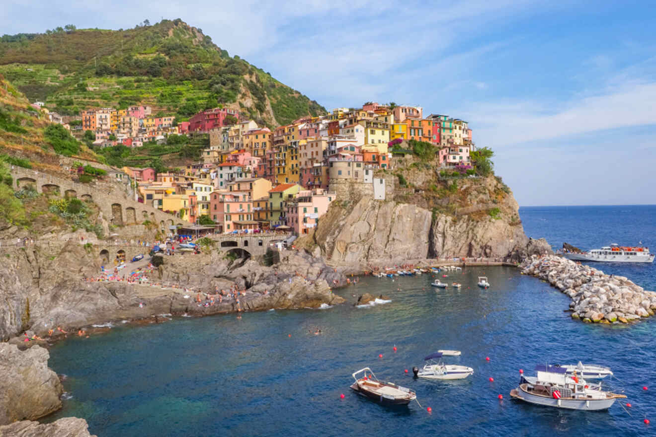 a group of boats floating near colorful houses