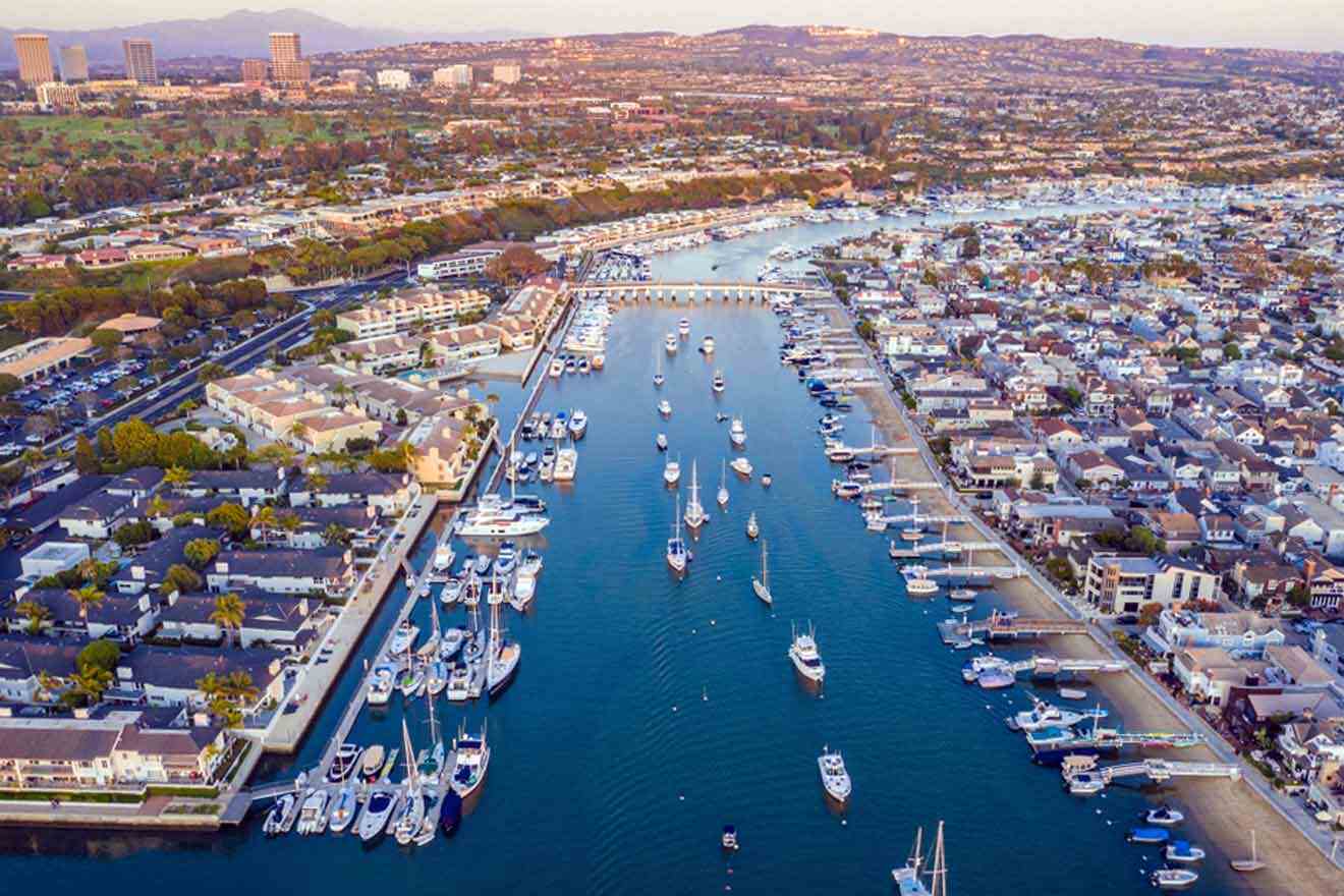 a harbor filled with lots of boats next to a city