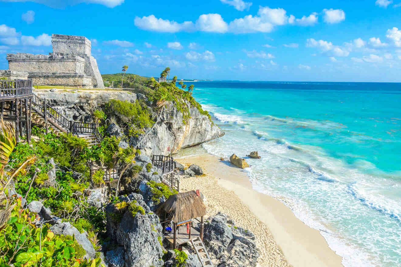 a view of the beach and ocean from a cliff