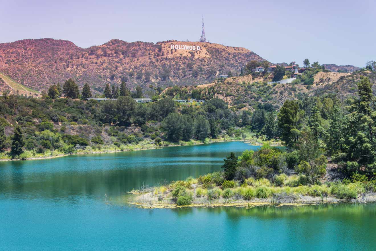 a blue lake surrounded by trees and mountains