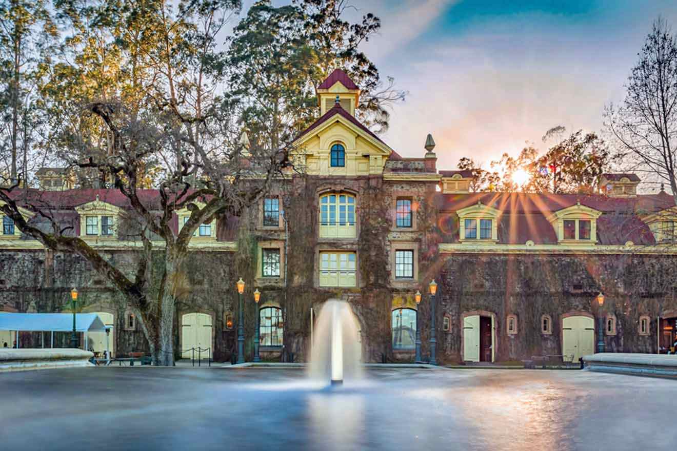 a large building with a fountain in front of it