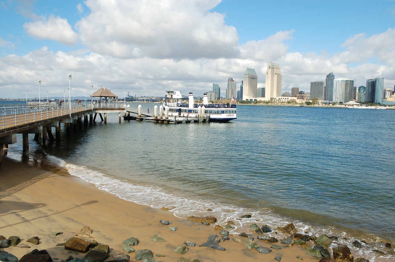 a boat is docked at the end of a pier