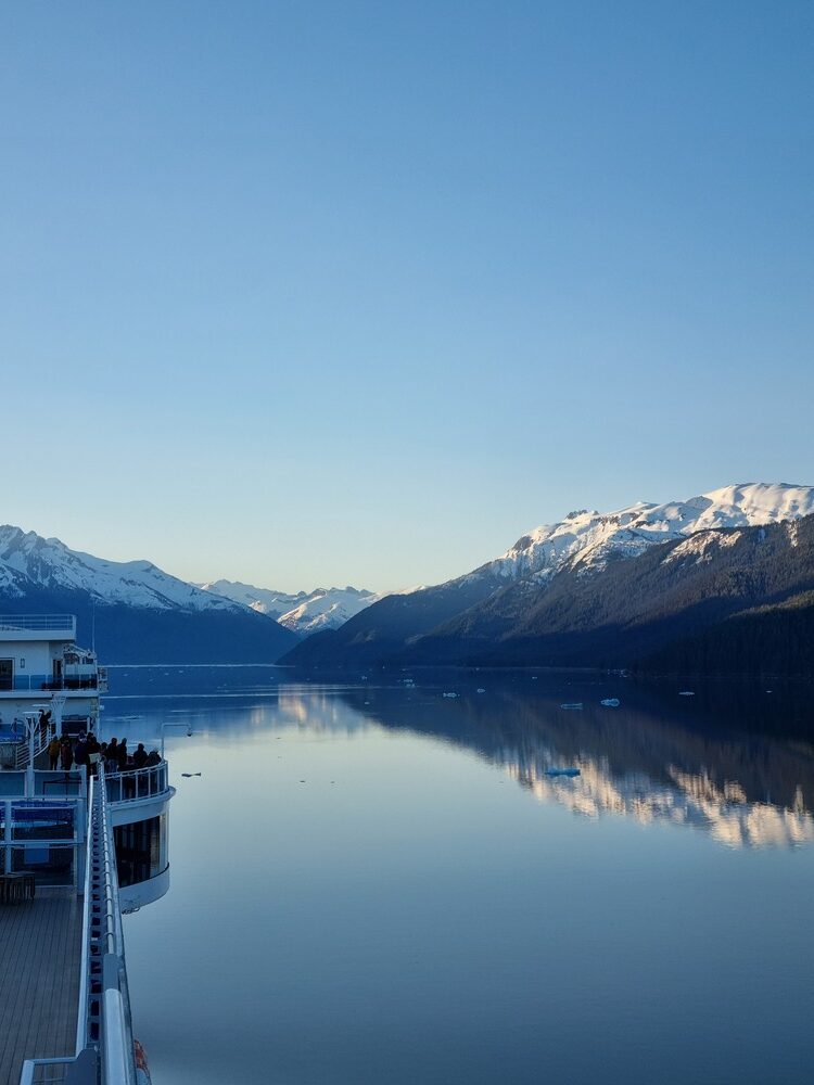 cruise ship looking at mountains on alaskan river