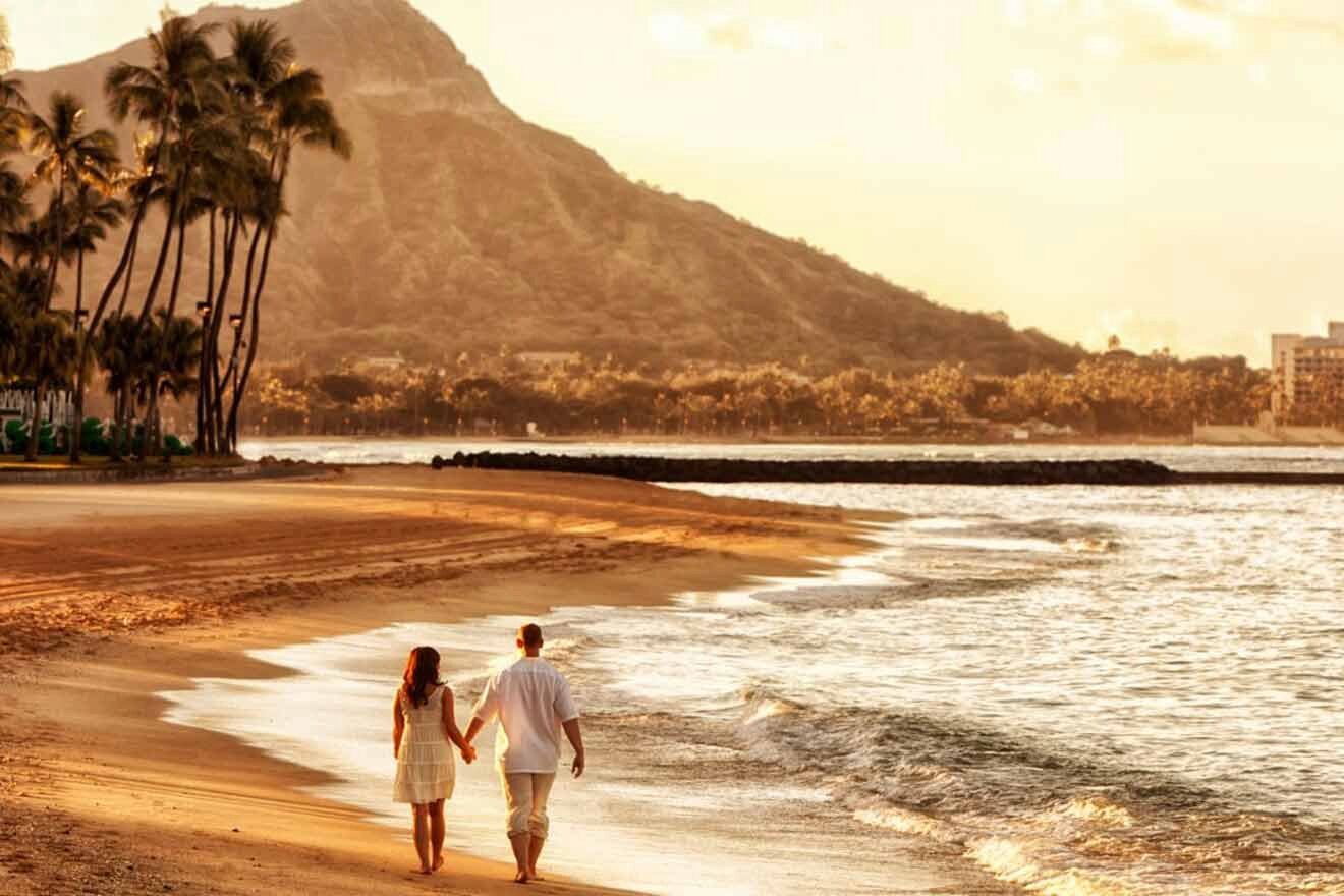 couple walking on the beach at sunset